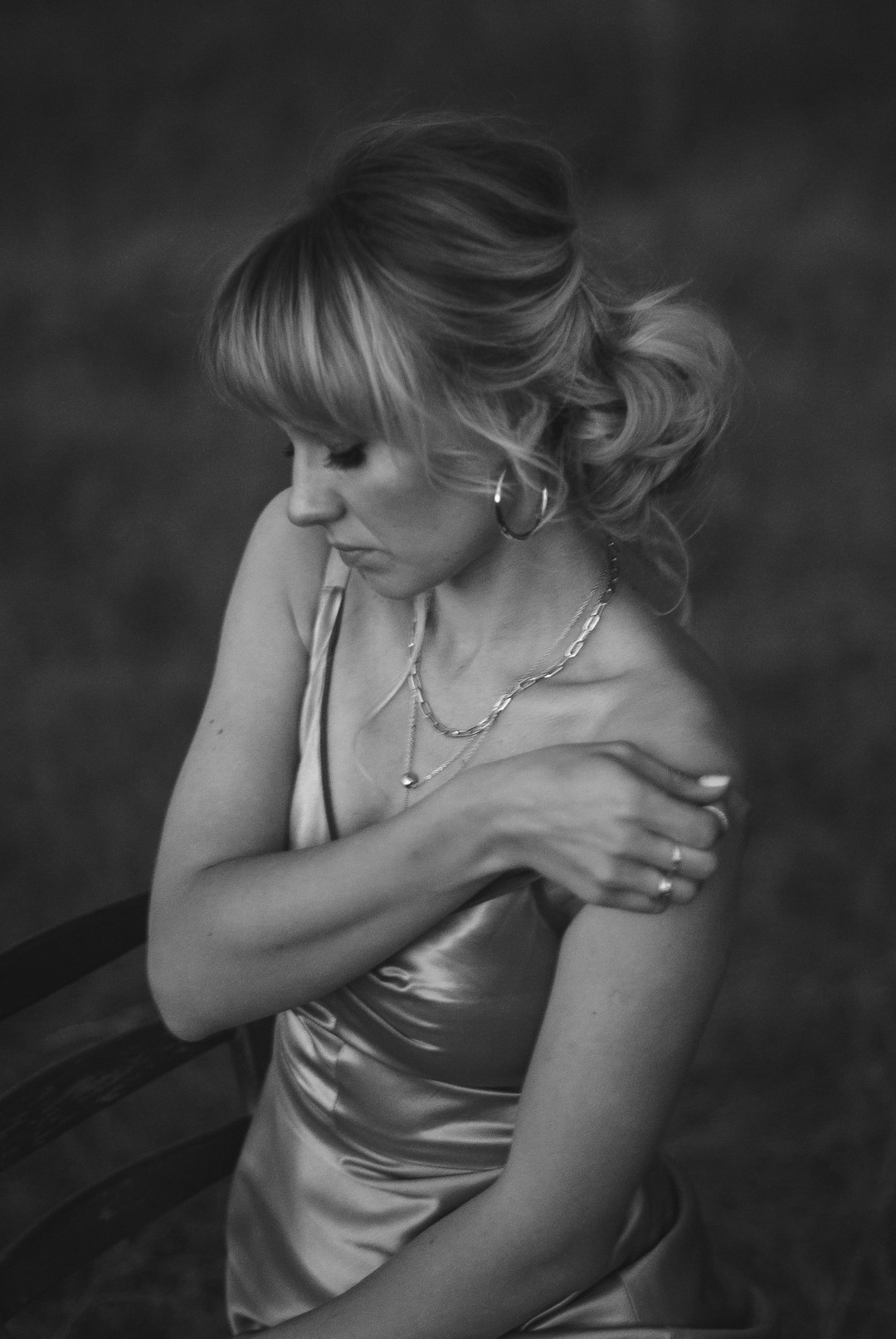 Black slip dress with silver statement jewelry - evening edit