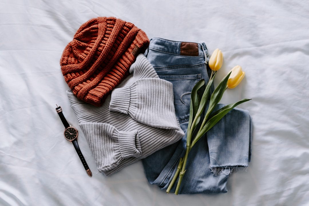 Curated outfit flat-lay - cashmere and leather accessories